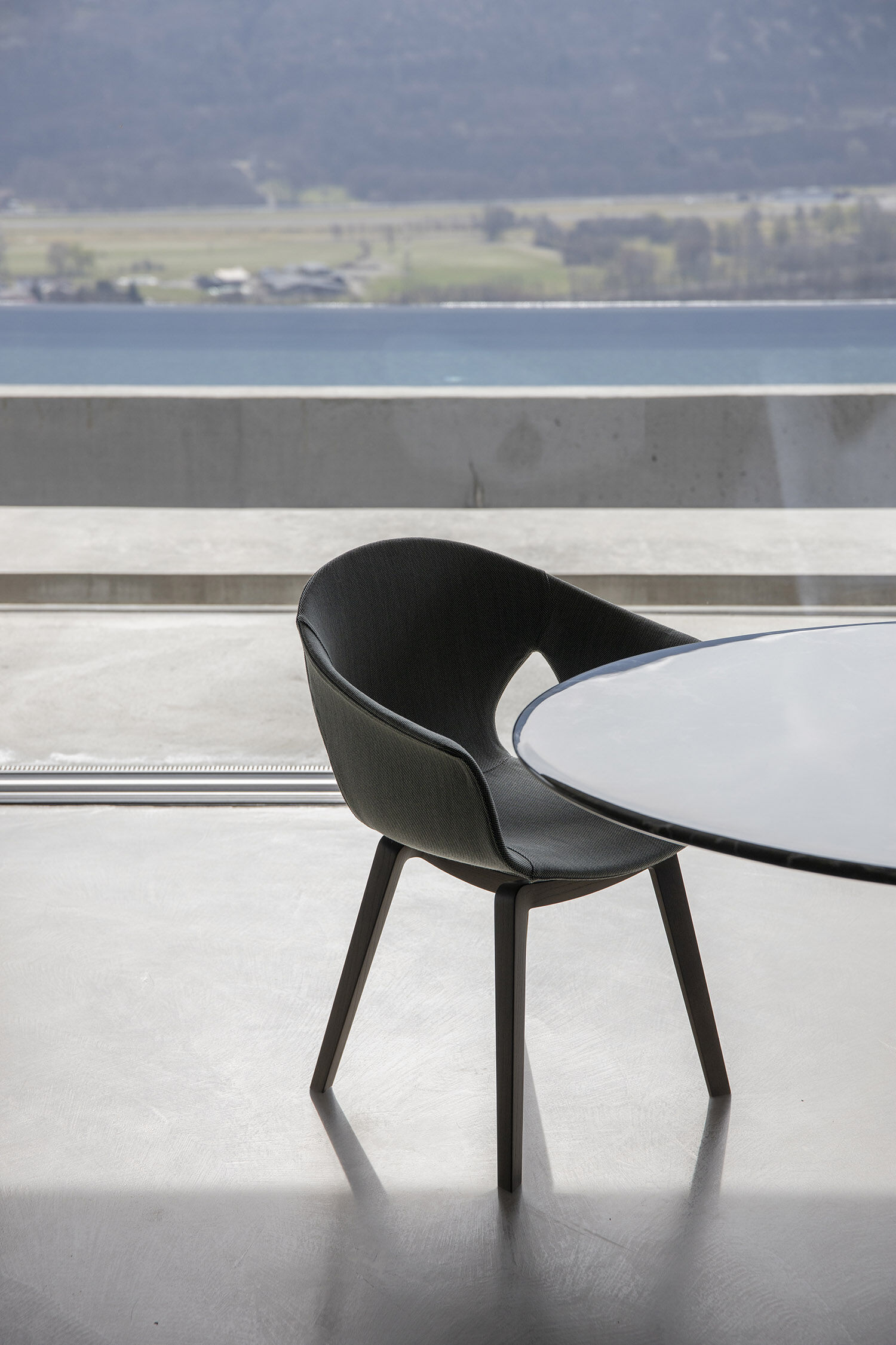 Modern Curved Brown Leather Armchair with Solid Dark Wood Legs Ergonomic Lounge Seat