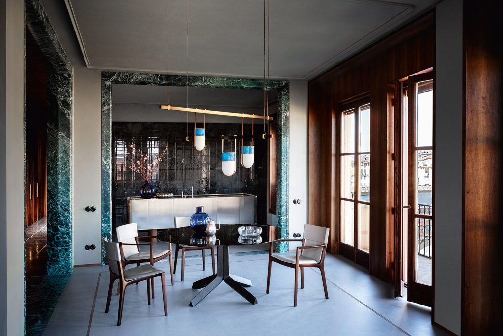 Tan Leather Dining Chair with Dark Wood Frame and Sleek Curved Design