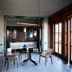 Tan Leather Dining Chair with Dark Wood Frame and Sleek Curved Design