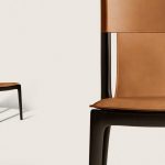 Tan Leather Dining Chair with Dark Wood Frame and Sleek Curved Design